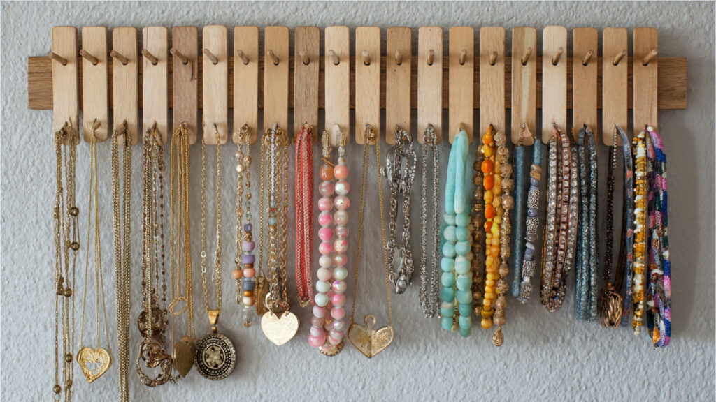 diy popsicle stick jewelry organizer mounted on wa