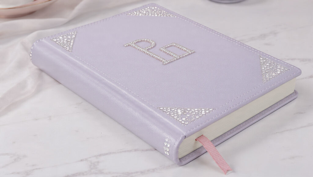 18 Cute Things to Bedazzle for Trendy DIY Crafts and Gifts a pastel colored notebook with sparkling rhineston