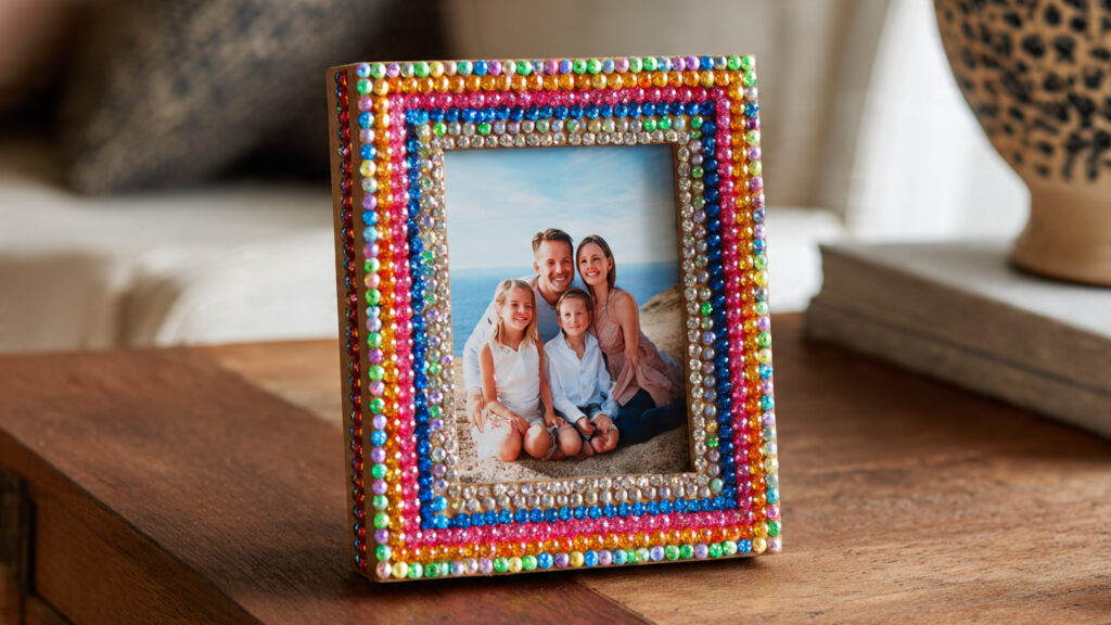 18 Cute Things to Bedazzle for Trendy DIY Crafts and Gifts photo frame covered with multicolored rhine